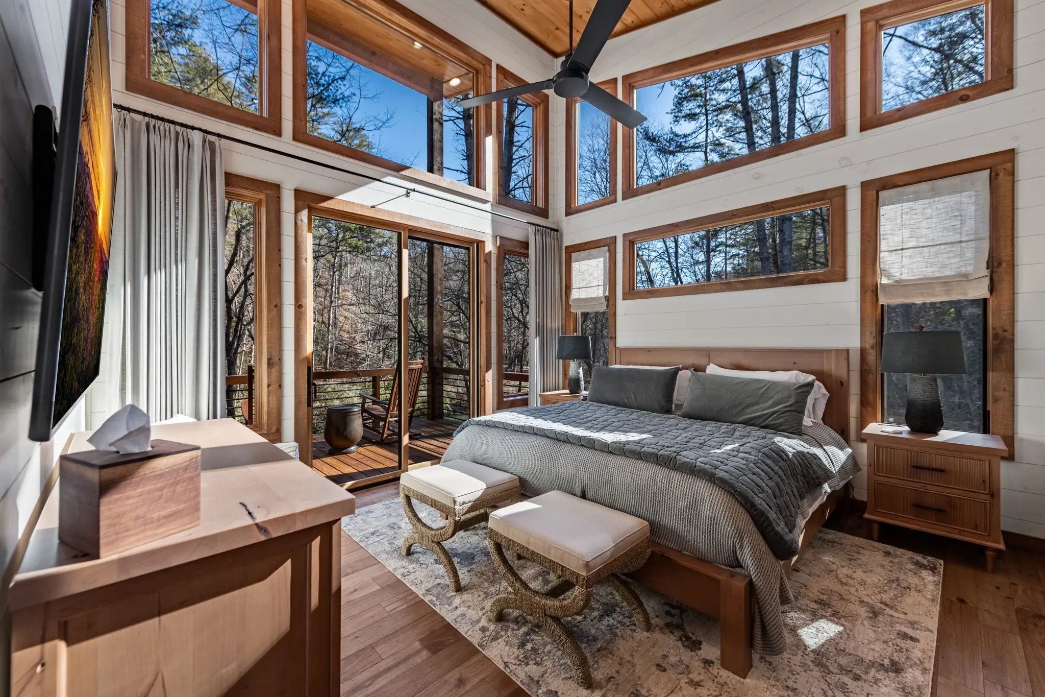 Guest-ready secondary bedroom with layered bedding and warm light.