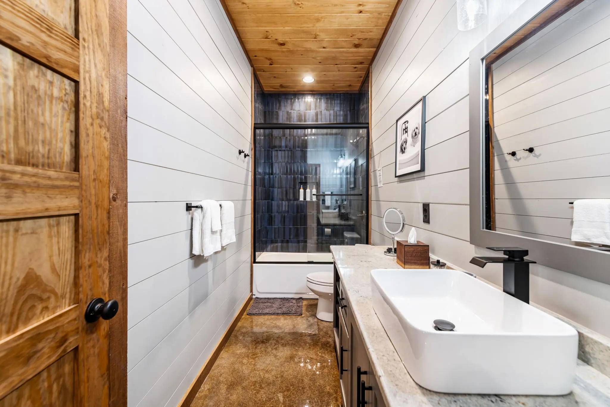 Secondary bedroom ensuite bath with modern finishes.